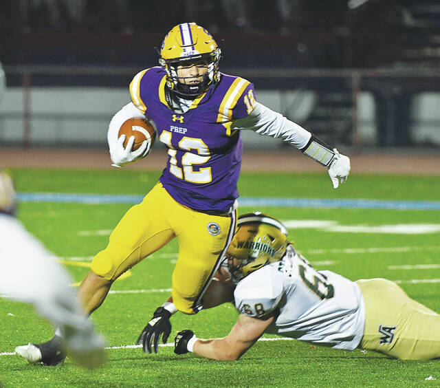 131070013_web1_WA-Prep-ftbl-3
Wyoming Areas Andrew Steinberger (68) gets a hand on Scranton Preps Will McPartland (12) to trip him up in the backfield.
Tony Callaio | For Times Leader