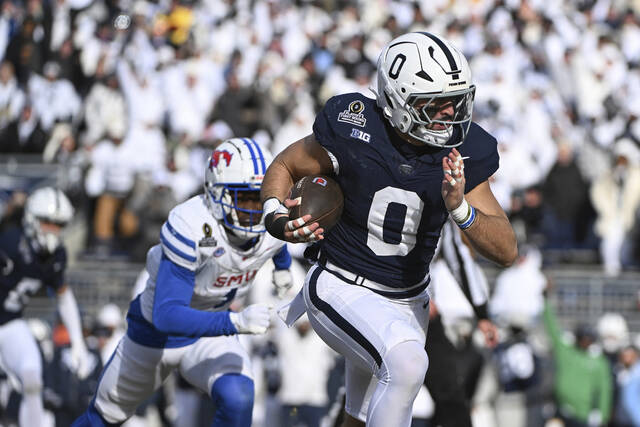 131161478_web1_AP24356665996052
Penn State linebacker Dominic DeLuca returns an interception for a touchdown while being chased by SMU running back Brashard Smith during the first half in the first round of the NCAA College Football Playoff on Saturday in State College.
AP Photo