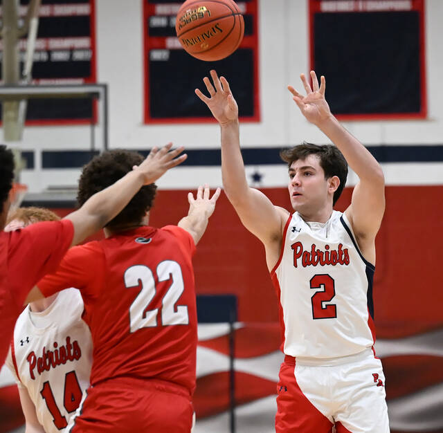 131257854_web1_PA-Haz-BBB-1
Pittston Areas Silvio Giardina (2) hits a 3-point shot against Hazleton Area.
Tony Callaio | For Times Leader