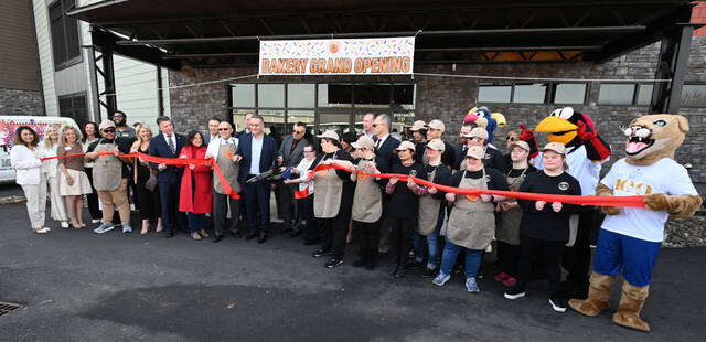 131366387_web1_Bakery-Inclusive-Ribbon-Cutting-6
Frank Bartoli, PA Inclusive president & CEO, along with his daughter Ellie, cut the ribbon of Coffee Inclusives new venture, The Bakery at Coffee Inclusive on Friday.
Tony Callaio | For Sunday Dispatch