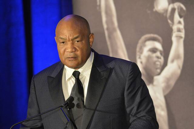 131384973_web1_131384973-3569312287dd4bba92b1feb5591e329b
Former heavyweight boxing champion George Foreman gives a stern look to Muhammad Ali during the Sports Illustrated Legacy Awards Thursday, Oct. 1, 2015, in Louisville, Ky.
AP file photo