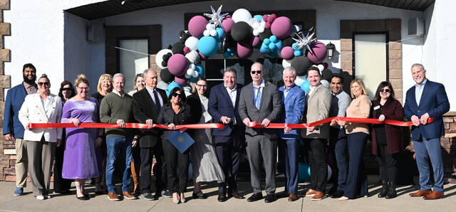 131398641_web1_The-Venue-Ribbon-cutting-1
Jeffrey Metz, with scissors in hand, president & CEO of Metz Culinry Management Environmental Services, stands to the left of Carl Beardsley, Wilkes-Barre/Scranton International Airport executive director, as they cut the ribbon at The Venue by Culinary Creations, and entertaining event destination located at the doorstep of the airport across from the Best Western Plus, Dupont.
Tony Callaio | For Sunday Dispatch