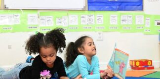 
			
				                                Nyla and Mariana seem appear to be pleased with the books by author Mo Willems, all featuring animal characters, that they will be able to take home.
                                 Mark Guydish | For Sunday Dispatch

			
		
