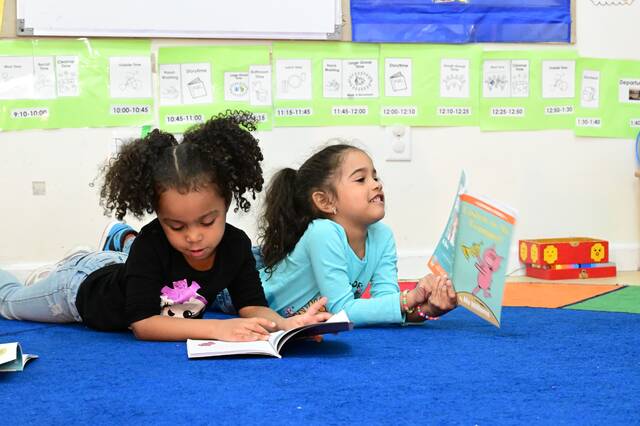131401903_web1_READ-2
Nyla and Mariana seem appear to be pleased with the books by author Mo Willems, all featuring animal characters, that they will be able to take home.
Mark Guydish | For Sunday Dispatch
