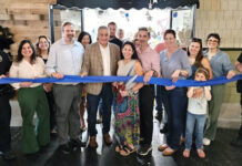 
			
				                                Catherine Duffy, center with scissors, owner of 3 Sisters, held a ribbon-cutting ceremony alongside City of Pittston Mayor Michael Lombardo and other officials at the Waterfront Warehouse, 350 Kennedy Blvd., Pittston. Submitted photo
                                 Tony Callaio | For Sunday Dispatch

			
		