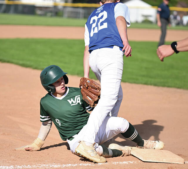 131486748_web1_WA-Hanover-Bsbl-5
Hanover Hawkeye third baseman Nate Wright (22) is late with a tag on Warrior Jeremy Layland.
Tony Callaio | For Sunday Dispatch