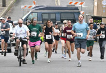 
			
				                                The inaugural West Pittston Cherry Blossom Festival 2-mile run takes off Saturday morning led by 91-year-old Warren Pollard on the bicycle to map the route out for the runners.
                                 Tony Callaio | For Sunday Dispatch

			
		