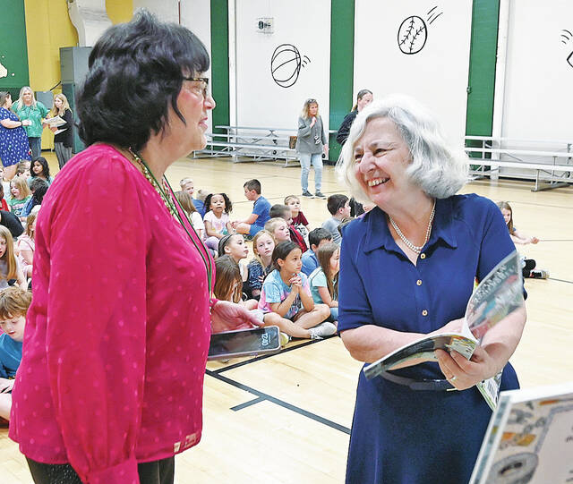 131501381_web1_Lucille-Colandro-WA-1
Wyoming Area Reading Specialist Caroline Flickinger, left, chats with old friend former Wyoming Area faculty member-turned-childrens author Lucille Colandro. Colandro was asked to read some of her award-winning books to the students of the Primary Center on Thursday, May 8.
Tony Callaio | For Sunday Dispatch