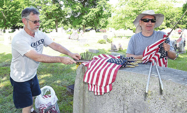 131516416_web1_WP-Am-Leg-Flag-Replacements-2
Joe Fanti, left, and Joe Kirby, were busy collecting old U.S. Flags at the West Pittston Cemetery in 2024. New flags where placed under the supervision of the West Pittston 1st Lt. Jeffrey DePrimo American Legion Post 542.
Tony Callaio file photo | For Times Leader