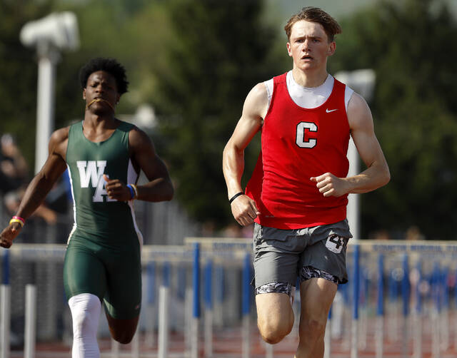 131519783_web1_trb4_faa
Crestwoods Elijah Zeneski won his preliminary heat ahead of Wyoming Areas Lidge Kellum in the District 2 Class 3A 110 meter hurdles on Thursday.
Fred Adams | For Sunday Dispatch