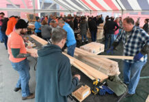 
			
				                                Over 85 volunteers participating in the 32nd Annual United Way of Wyoming Valley’s Day of Caring are seen at Diamond Manufacturing, Wyoming, to construct wood-framed beds for the Sleep in Heavenly Peace organization for children three to 18 years of age without a bed.
                                 Tony Callaio | For Sunday Dispatch

			
		