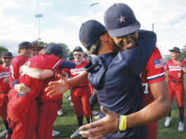 
			
				                                Pittston Area coach Paul Zaffuto hugs his pitcher Elijah Barr after winning the District 2 Class 5A championship Thursday afternoon 3-1 over Abington Heights.
                                 Fred Adams | For Times Leader

			
		