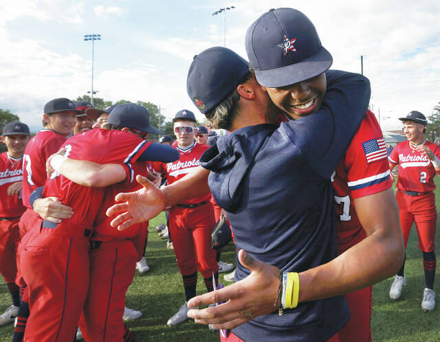 131548073_web1_pit_ah5_faa
Pittston Area coach Paul Zaffuto hugs his pitcher Elijah Barr after winning the District 2 Class 5A championship Thursday afternoon 3-1 over Abington Heights.
Fred Adams | For Times Leader
