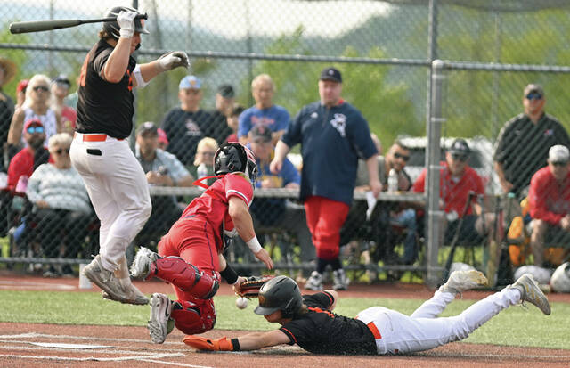 131566222_web1_PA-Palmyra-bsbl-5
Palmyras Jonathan Meley steals home and is safe on an errant throw to the plate for the go-ahead run. Meley scored twice for Palmyra.
Tony Callaio | For Times Leader