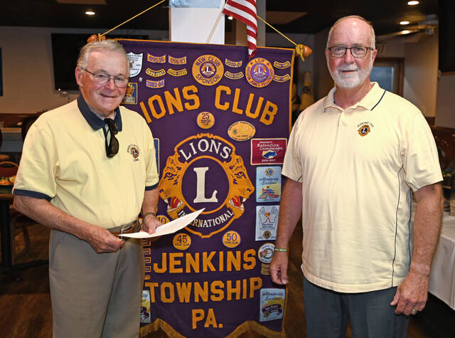 131612731_web1_Jenkins-Twp.-Lions-Installation-1
Tom Ruskey, left, and Bob Linskey, right, are co-chairs of the scholarship program of Jenkins Twp. Lions Club. The Lions Club gave out 16 scholarships last year to Jenkins Twp. students.
Tony Callaio | For Sunday Dispatch