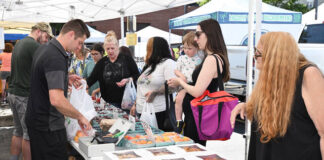 
			
				                                Behind the table, Logan Brace, right, and Joe Erzar, left, from Brace’s Orchard, will be busy on the first day of the City of Pittston’s Farmer’s Market, at the site of the Pittston Tomato Festival, on Tuesday, July 1.
                                 Tony Callaio file photo | For Sunday Dispatch

			
		