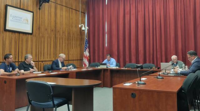 131630259_web1_ethics
Luzerne Countys Ethics Commission discussed the need for a pressing ethics code change Monday with two council members. Seated, from left, are: county Council Chairman John Lombardo; county Administrative Services Division Head Jim Rose, the county managers ethics commission designee; Councilman Harry Haas; and these commission members: county District Attorney Sam Sanguedolce, county Controller Walter Griffith and citizen Ben Herring. Jay Notartomaso, the remaining citizen commission member, attended remotely.
Jennifer Learn-Andes | Times Leader