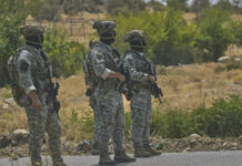 
			
				                                Forces of the regional Kurdish administration patrol the area ahead of a symbolic disarmament ceremony by the separatist PKK group as part of the peace process with Turkey on Friday in Sulaymaniyah governorate, Iraq.
                                 AP Photo

			
		