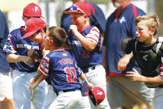 131642157_web1_gpa2_faa
The GPA players celebrate their 4-1 win over Mountain Top on Saturday, July 5.
Fred Adams | For Sunday Dispatch