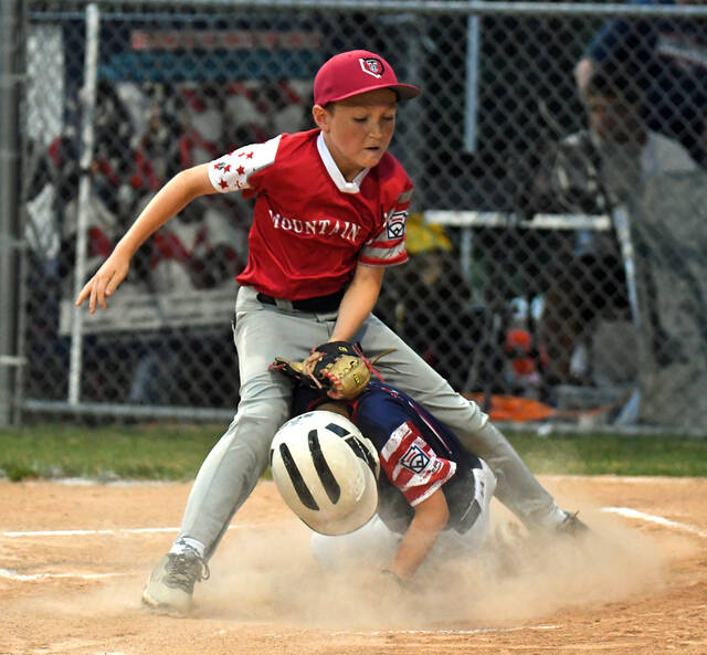 131642276_web1_GPT-Mt-Top-1
GPTs Wyatt Nielsen is safe at home as he slides ahead of Mountain Tops Garrett Chalkers tag.
Tony Callaio | For Sunday Dispatch