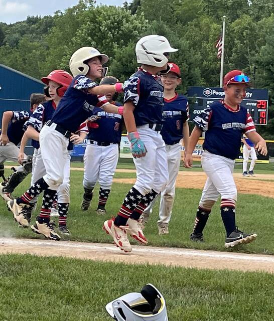 131644627_web1_GPT_celebration
Anthony Cerasaro receives a slap on the back from Greater Pittston Township teammate Anthony Cortese after Cerasaro drew the game-ending, bases-loaded walk in Sundays 11-10 win over Carbino Club/Archbald. Dominic Macario is at right.
Tom Robinson | For Times Leader
