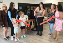 
			
				                                Melanie Lombardo cuts the ribbon on her consignment/vintage clothing store, Ghost Threads, at 924 Exeter Ave., Exeter. From left: Lora Lombardo, Ria Lombardo, Quinn O’Sullivan (3), Blake O’Sullivan (5), Melanie Lombardo, Brandi Bartush and Michelle Mikitish, Greater Pittston Chamber of Commerce.
                                 Tony Callaio | For Sunday Dispatch

			
		