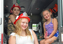 
			
				                                Aryanna Ehrhardt, 13, back left, Kaylin Fumia, 13, center, Natalie Fumia, 6, right, get a chance to sit inside a Pittston Twp. Fire truck during Emergency Services Day at Pittston Twp. on Saturday, July 12.
                                 Tony Callaio | For Sunday Dispatch

			
		