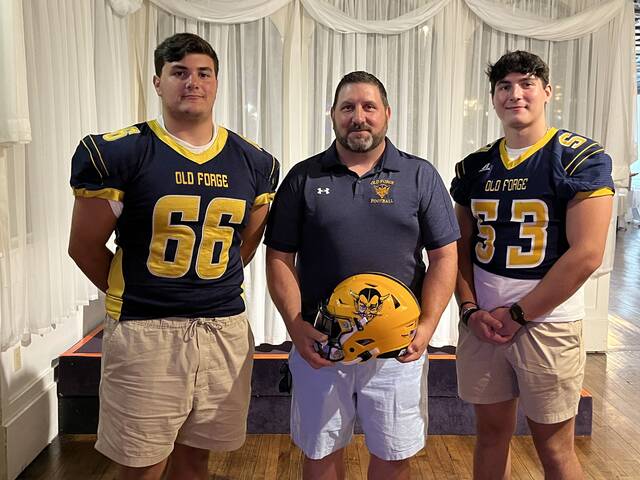 131687633_web1_5657F212-4F21-409E-926C-4268EA5A4A45
Old Forge was represented at Lackawanna Football Conference Media Day by, from left, Jake Lucarelli, coach Mike Schuback and Will Wozniak.
Tom Robinson | For Sunday Dispatch