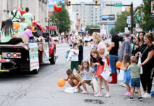 
			
				                                What would the parade be without children picking up tossed candy along the route, as shown here in 2024?
                                 Tony Callaio file photo | For Sunday Dispatch

			
		