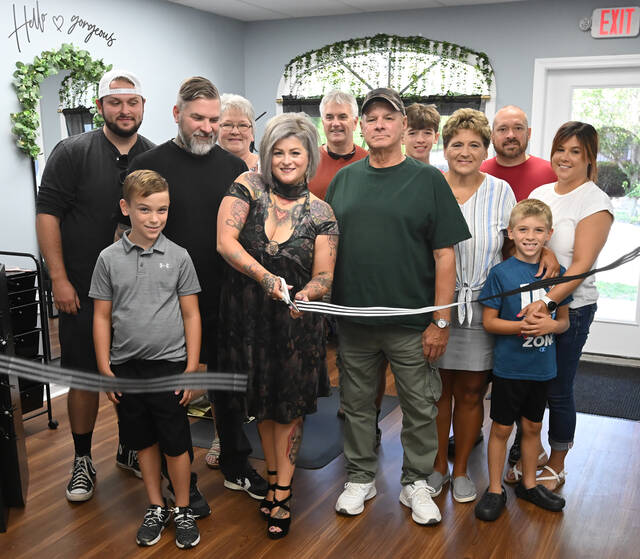 131702526_web1_Dark-Elegance-Salon-1
Ashlee Balent, shown cutting the ribbon on her new salon, Dark Elegance, at 517 Luzerne Ave., West Pittston, is surrounded by family and friends.
Tony Callaio | For Sunday Dispatch