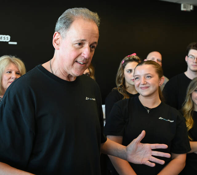 <p>Jim DeMichele, proprietor of Aira Fitness, addressed those gathered for the fitness center’s grand opening. DeMichele’s daughter Ava, right, looks on.</p>
<p>Tony Callaio | For Sunday Dispatch</p>
