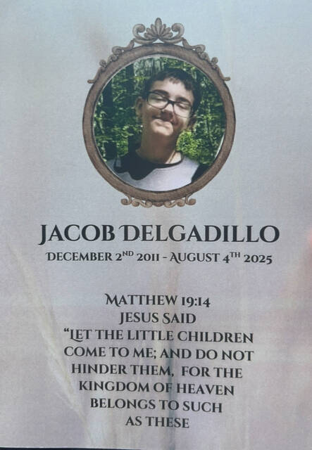 131709788_web1_funeral4
This memorial card for 13-year-old Butler Township murder victim Jacob Delgadillo was distributed at his funeral on Tuesday.