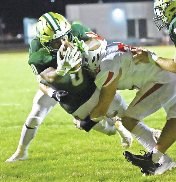 131733202_web1_WA-Crestwood-ftbl-1
Wyoming Areas Trustin Johnson blasts through for a 5-yard touchdown run against Crestwood in Friday nights season-opener.
Tony Callaio | For Times Leader