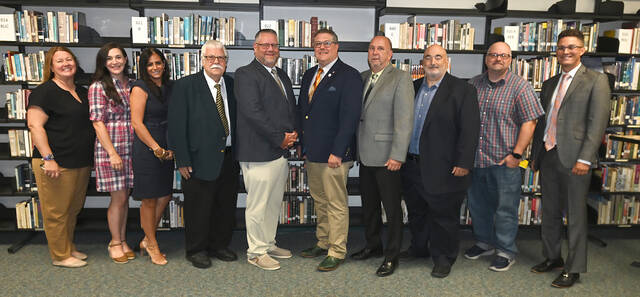 131733909_web1_WA-Greg-Reilly-Appointed
Greg Reilly has been appointed and will take over as principal of the Wyoming Area Secondary Center in Exeter. From left, Wyoming Area board members Erica Gazda, Kirby Kunkle, Mara Valenti, Joe Kopko, Reilly, Dr. Jon Pollard, superintendent, Phil Campenni, Dave Alberigi, Michael Supey, Atty. Peter Butera. Absent: Michael Kachmarsky.
Tony Callaio | For Sunday Dispatch
