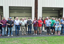 
			
				                                Joe McFarland Sr., center, black jacket, did the honors of cutting the ribbon of the new 42-by-52 foot pavilion at the Duryea VFW Post 1227. The construction of the pavilion was due in majority from a $100,000 grant from Lowe’s. Lowe’s COO, Joe McFarland Jr., an Old Forge native, was also on hand for the ceremony.
                                 Tony Callaio | For Sunday Dispatch

			
		
