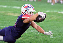 
			
				                                Pittston Area junior running back Jude Ferentino lunges towards the goal line scoring the second Patriot touchdown for the night against Mid Valley Friday night. 
                                 Tony Callaio | For Sunday Dispatch

			
		
