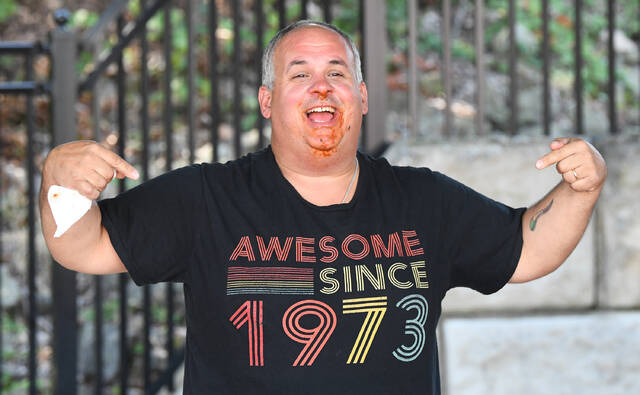 131735210_web1_Pic-7--2-
This years Spaghetti Eating Contest champion, Ted Ferraro of Dunmore, celebrates his victory.
Mark Moran | For Sunday Dispatch