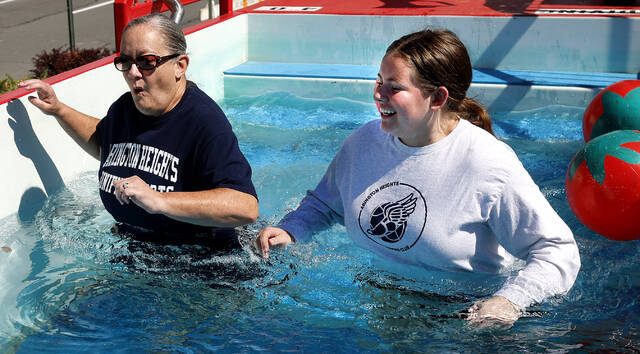 131735258_web1_plunge1_faa
Jen Hayner, 55, of Clarks Summit, and Ella Tourcher, 17, of Dalton, were the first to take the Polar Plunge challenge at the Pittston Tomato Festival on Saturday.
Fred Adams | For Sunday Dispatch