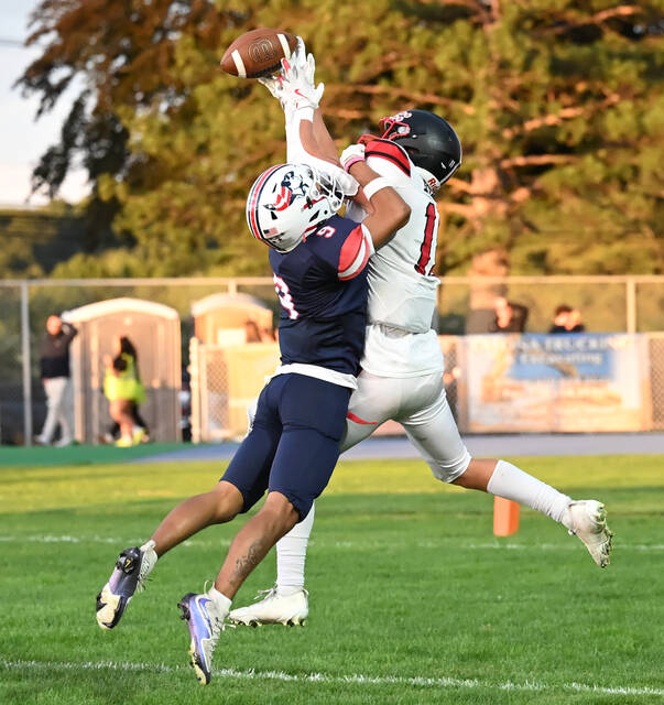 <p>The Patriots’ Paulie Ferentino (9) breaks up a North Pocono pass intended for Cole West (11).</p>
<p>Tony Callaio | For Sunday Dispatch</p>