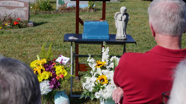 131763000_web1_funeral1
Flowers adorned the cremains of 13-year-old Butler Township murder victim Jacob Delgadillo Friday during his graveside funeral at St. Johns Cemetery in the township.
Jennifer Learn-Andes | Times Leader