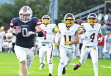 
			
				                                Pittston Area senior Brody Spindler (0) breaks away from a host of Wyoming Valley West Spartans to score a touchdown at Trippi Stadium on Friday.
                                 Tony Callaio | For Times Leader

			
		