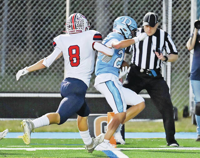 <p>Dallas’ Tyce Mason, right, tiptoes into the end zone on a 34-yard reception from Talan Geskey, narrowly beating Pittston Area’s Stephen Barnic to the goal line for the Mountaineers’ first score on Friday.</p>
<p>Tony Callaio | For Times Leader</p>