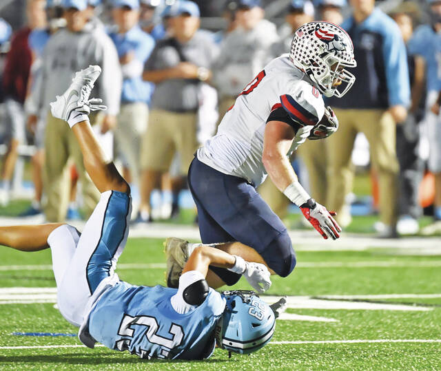 131796114_web1_PA-Dallas-ftbl-5
Pittston Areas Brody Spindler (0) breaks through a tackle by Tyce Masons to romp into the end zone for a 19-yard touchdown.
Tony Callaio | For Times Leader