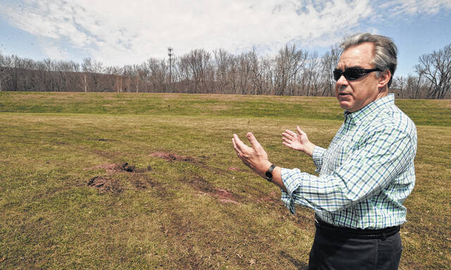 131808744_web1_TTL041415atvlevee2
In this 2015 file photo, Luzerne County Flood Protection Authority Executive Director Christopher Belleman discusses damage all-terrain vehicle trespassers were causing on the levee system in Wyoming. Belleman is retiring in January after 12 years overseeing the agency.
File photo