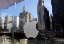 
			
				                                Buildings are reflected behind the logo at an Apple Store in downtown Chicago, Oct. 19, 2017.
                                 AP File Photo

			
		