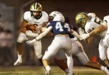 
			
				                                Wyoming Area quarterback Jack Gravine keeps the ball in the first quarter against Berwick.
                                 Fred Adams | For Sunday Dispatch

			
		