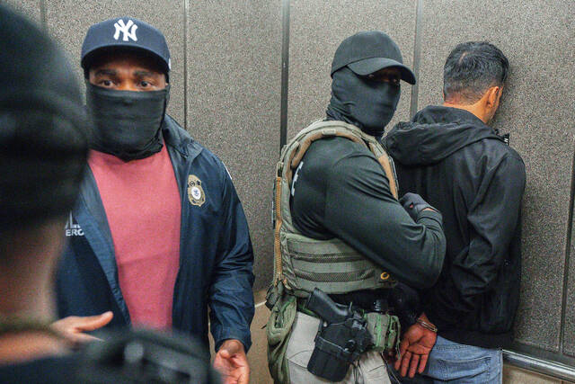 131860979_web1_AP25197812350613
FILE - Immigration and Customs Enforcement agents escort a detained immigrant into an elevator after he exited an immigration courtroom, June 17, 2025, in New York. (AP Photo/Olga Fedorova, file)
AP File Photo
