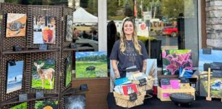 
			
				                                Leandra Hetro stands at her booth during one of Pittston’s Second Friday Artwalks. Her artwork will be exhibited at Art e Fekts Gallery, Pittston, from 5 p.m. to 7 p.m. Friday, Oct. 24.
                                 Submitted photo

			
		