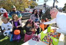 
			
				                                Greater Pittston Ambulance Association Chief Edward Szafran hands out candy in front of the Ambulance Association building on Main Street, Pittston, in 2022.
                                 Tony Callaio file photo | For Times Leader

			
		