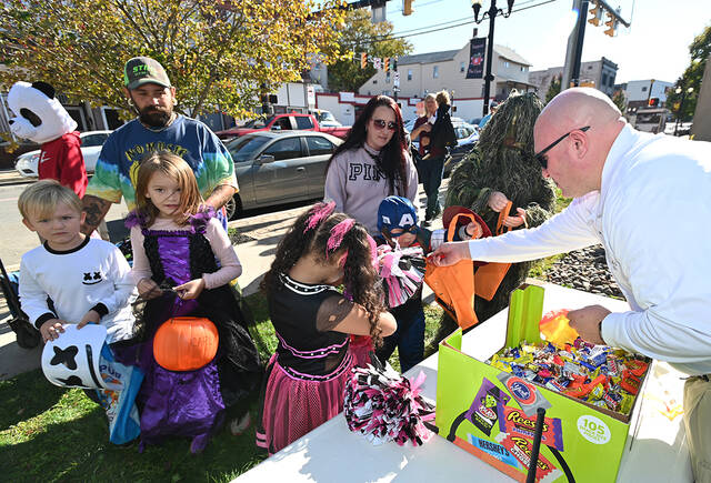 131864143_web1_Trick-or-Treat-Main-St.-Preview-1
Greater Pittston Ambulance Association Chief Edward Szafran hands out candy in front of the Ambulance Association building on Main Street, Pittston, in 2022.
Tony Callaio file photo | For Times Leader